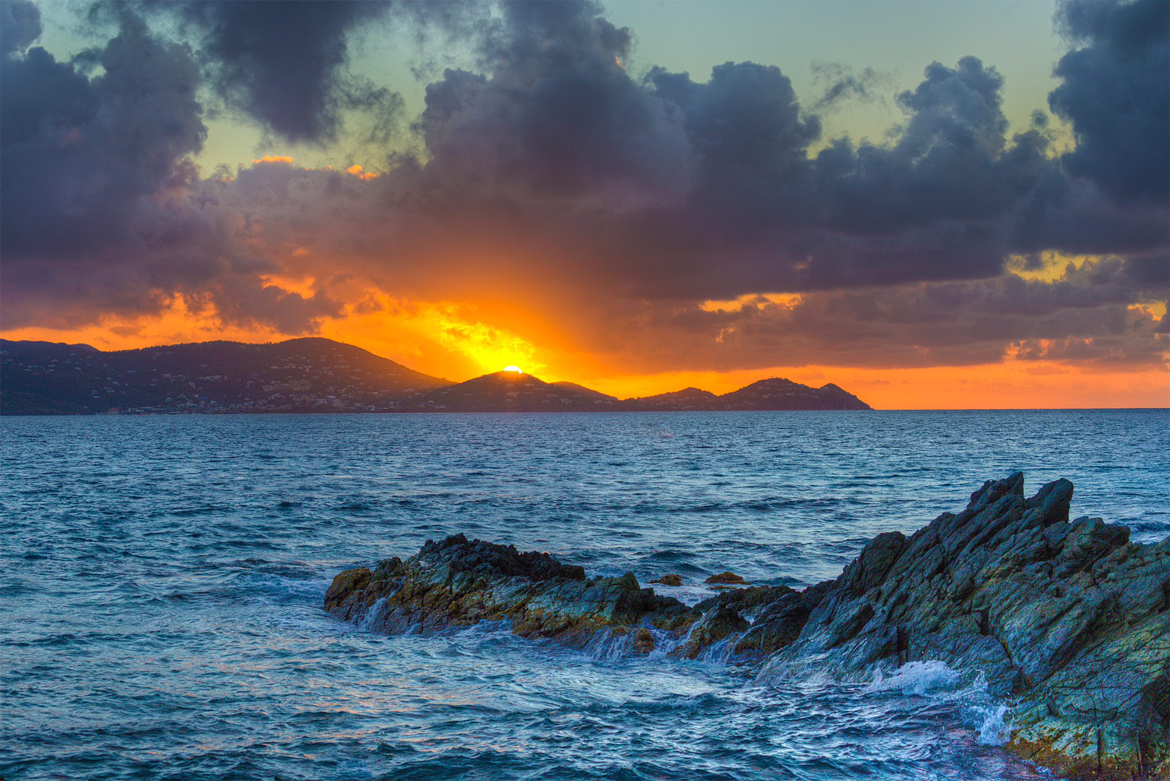 The sun sets over St. John